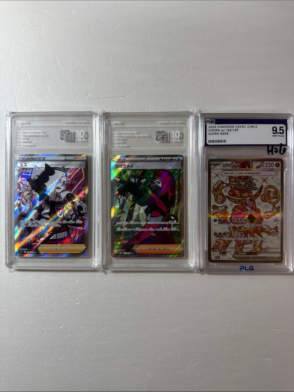 Pokemon Holofoil Trainer & EX Graded Card Trio - Multicolor